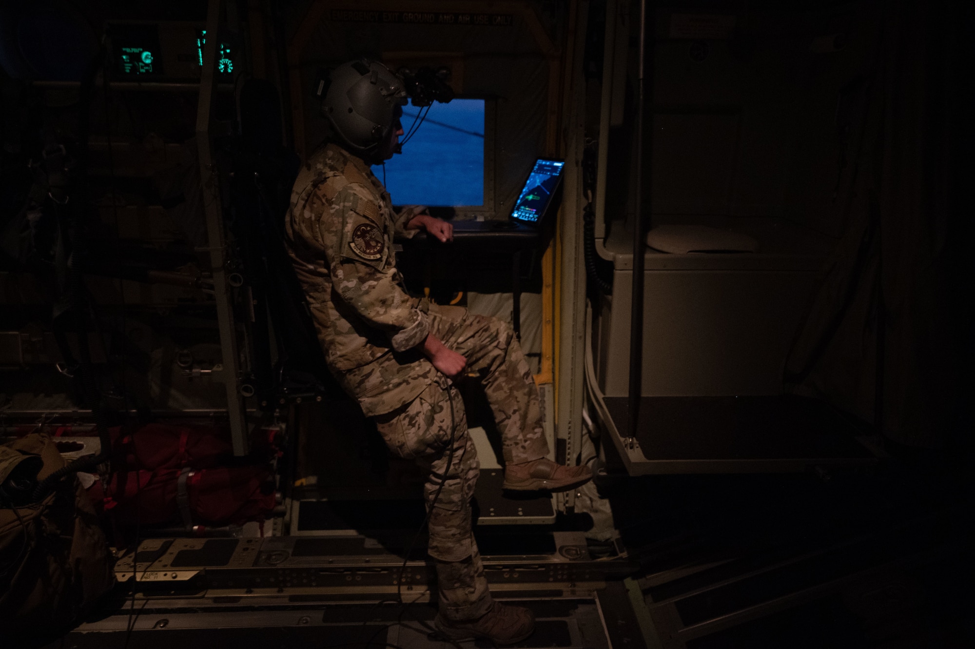 U.S. Air Force Tech. Sgt. Austin Schwier, 39 Rescue Squadron loadmaster, operates the refueling hose of an HC-130J Combat King II aircraft during high-speed air-to-air refueling with F/A-18 fighter aircraft off the eastern South Carolina coast, Oct. 26, 2023.