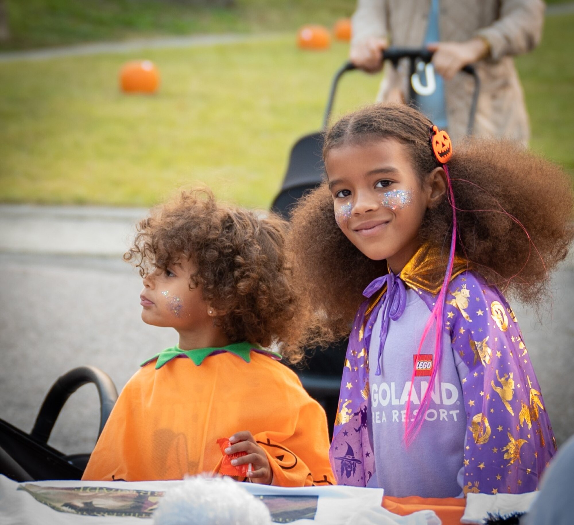 A military child poses for a photo during the Trunk-or-Treat event at Osan Air Base, Republic of Korea, Oct. 27, 2023. The event created a fun and safe environment for military families to celebrate Halloween through various activities to create community morale. (U.S. Air Force photo by Staff Sgt. Kelsea Caballero)
