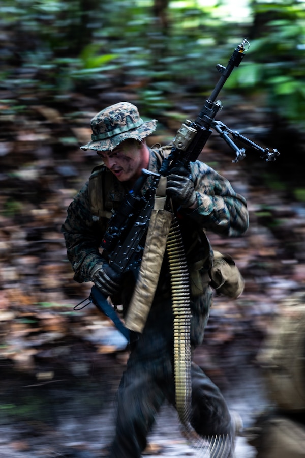 U.S. Marine Corps Lance Cpl. Ian Casado, a machine gunner with Fox Company, 2nd Battalion, 25th Marines partakes in a jungle raid drill during Tradewinds 23 at Camp Seweyo, Guyana on July 26, 2023. Tradewinds is a U.S. Southern Command-sponsored exercise designed to strengthen partnerships and interoperability, promote human rights, as well as increase all participants' training capacity and capacity to mitigate, plan for and respond to crises and security threats. (U.S. Marine Corps photo by Sgt. Emely Gonzalez)