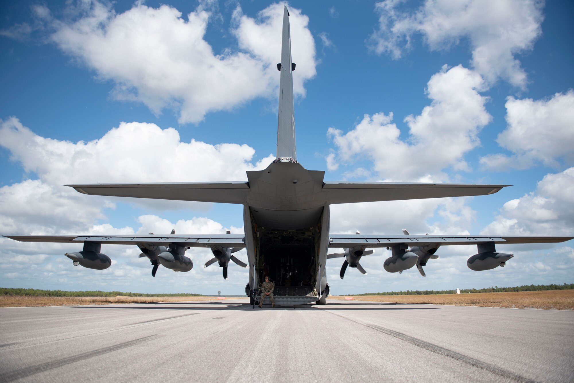 An HC-130J Combat King II aircraft sits ready on a runway at Hurlburt Field, Florida, Oct. 26, 2023. The HC-130J Combat King II aircraft is able to land on short runways, as well as a variety of less than ideal environments including dirt runways, in sand, and under combat conditions. (U.S. Air Force photo by Staff Sgt. Thomas Johns)