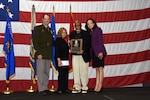 Brig. Gen. Matthew Strub, Wisconsin’s deputy adjutant general for Army, presents the family of 1st Lt. Thomas E. Wortham IV with a plaque during a Wisconsin Army National Guard Hall of Honor induction ceremony Oct. 27 at Joint Force Headquarters in Madison, Wis.