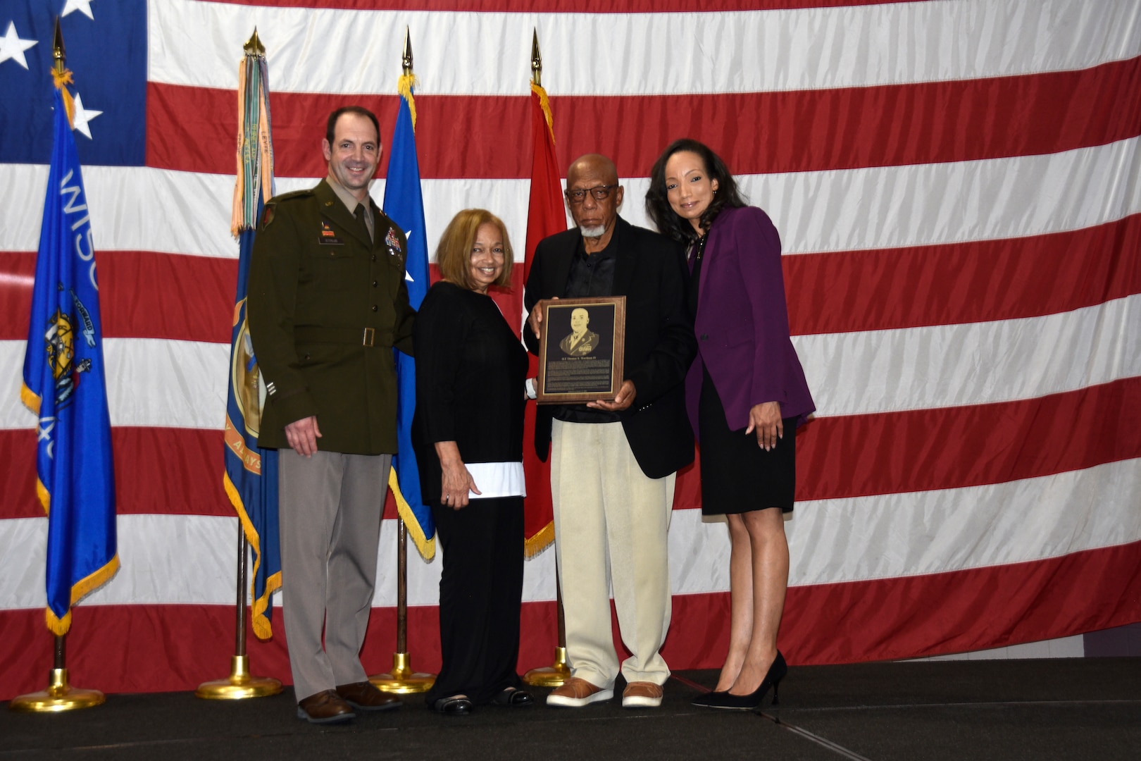 Brig. Gen. Matthew Strub, Wisconsin’s deputy adjutant general for Army, presents the family of 1st Lt. Thomas E. Wortham IV with a plaque during a Wisconsin Army National Guard Hall of Honor induction ceremony Oct. 27 at Joint Force Headquarters in Madison, Wis.