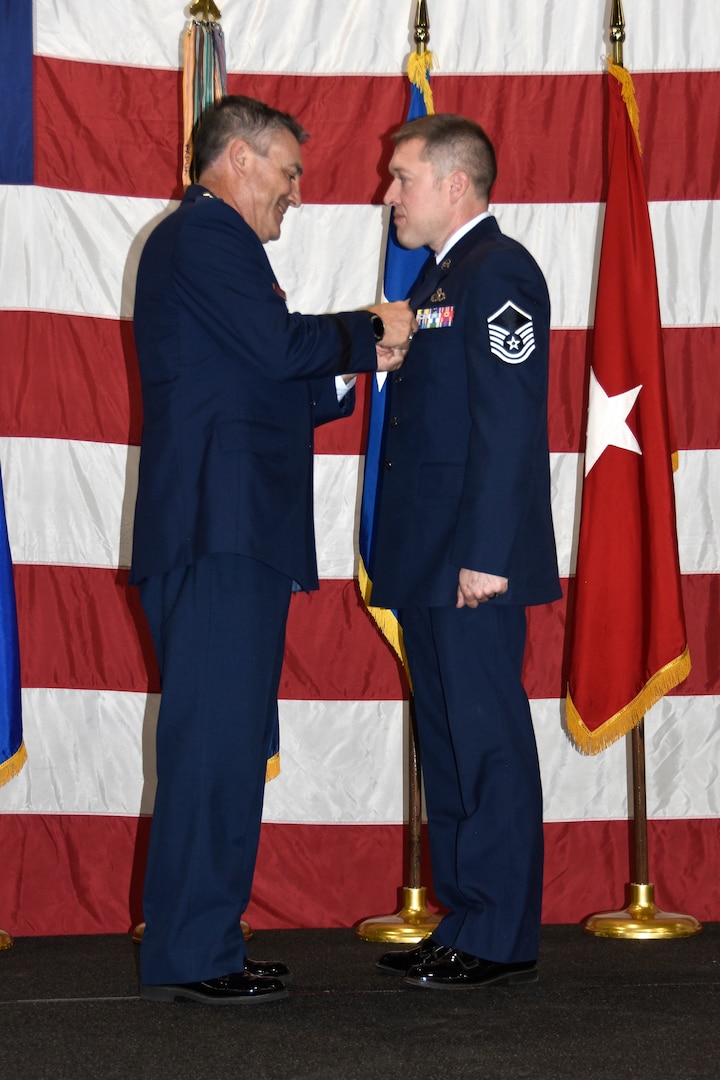 Maj. Gen. Paul Knapp, Wisconsin’s adjutant general, awards Master Sgt. Charles Ells with the 1st Lt. Thomas E. Wortham IV medal Oct. 27 at Joint Force Headquarters in Madison, Wis.