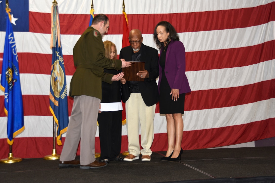 Brig. Gen. Matthew Strub, Wisconsin’s deputy adjutant general for Army, presents the family of 1st Lt. Thomas E. Wortham IV with a certificate from Gov. Tony Evers during a Wisconsin Army National Guard Hall of Honor induction ceremony Oct. 27 at Joint Force Headquarters in Madison, Wis.