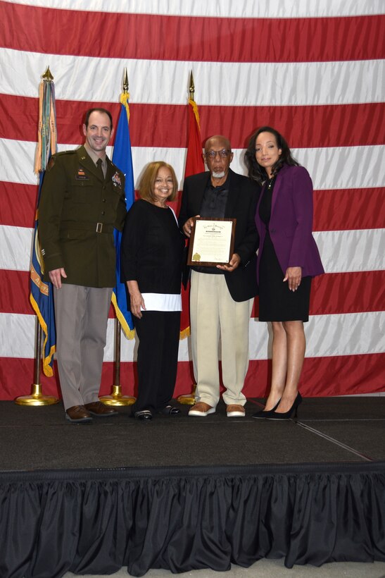 Brig. Gen. Matthew Strub, Wisconsin’s deputy adjutant general for Army, presents the family of 1st Lt. Thomas E. Wortham IV with a certificate from Gov. Tony Evers during a Wisconsin Army National Guard Hall of Honor induction ceremony Oct. 27 at Joint Force Headquarters in Madison, Wis.