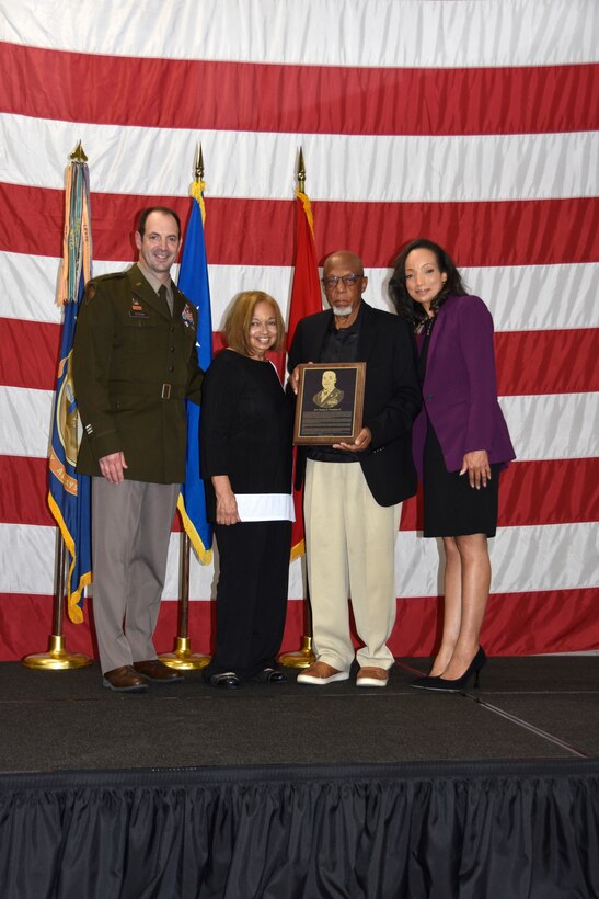 Brig. Gen. Matthew Strub, Wisconsin’s deputy adjutant general for Army, presents the family of 1st Lt. Thomas E. Wortham IV with a plaque during a Wisconsin Army National Guard Hall of Honor induction ceremony Oct. 27 at Joint Force Headquarters in Madison, Wis