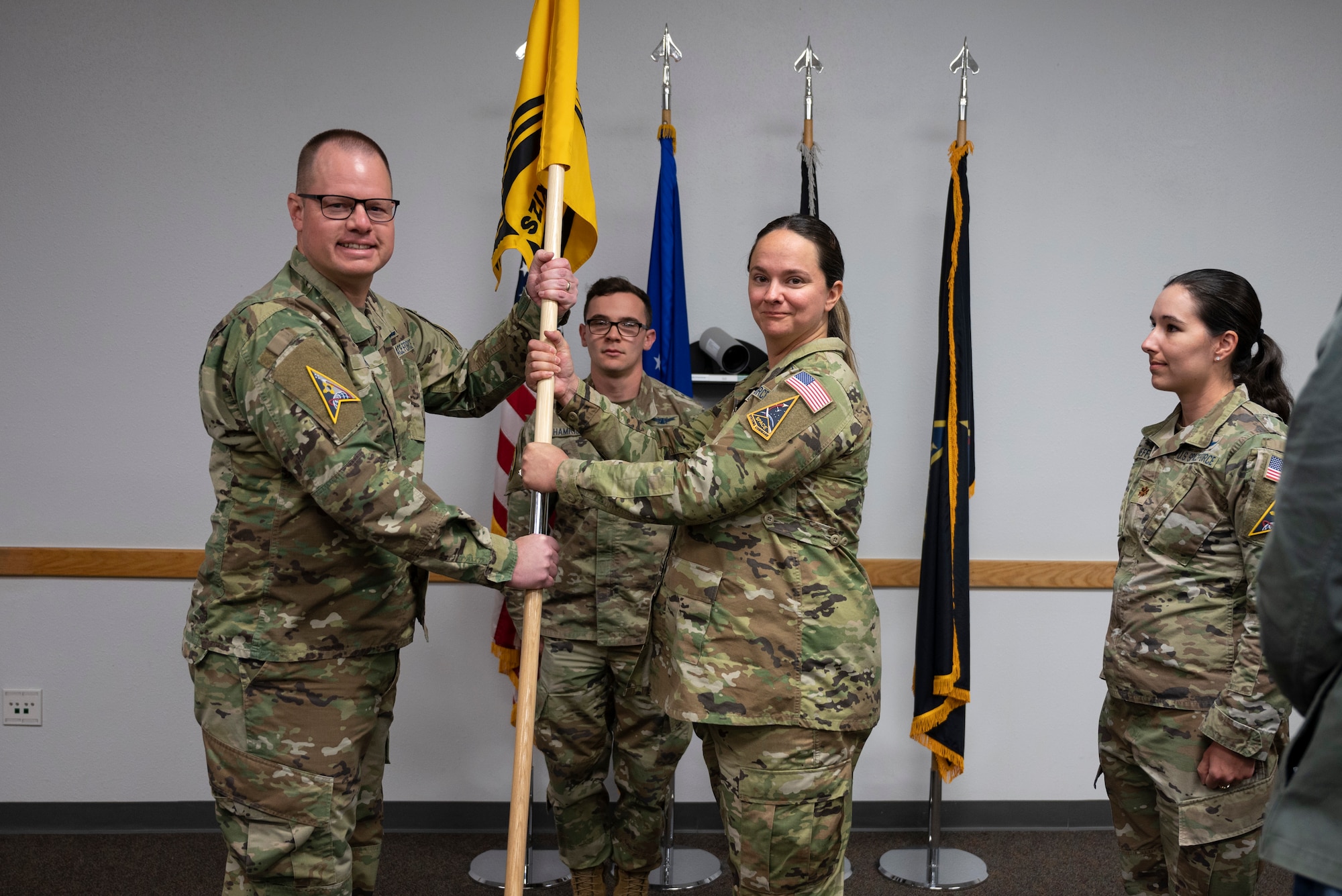 A man passes a guidon.