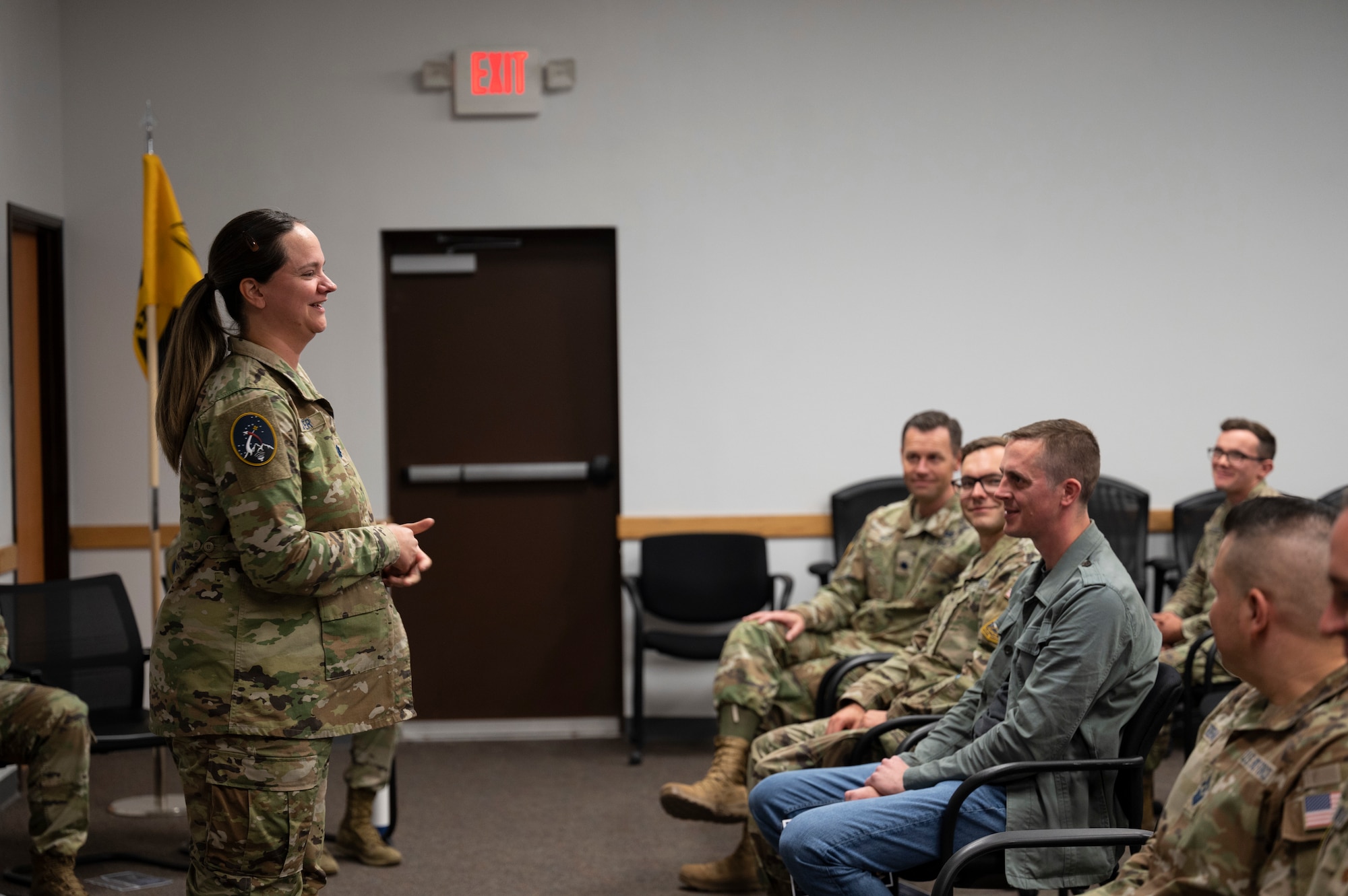 A woman speaks to a crowd.