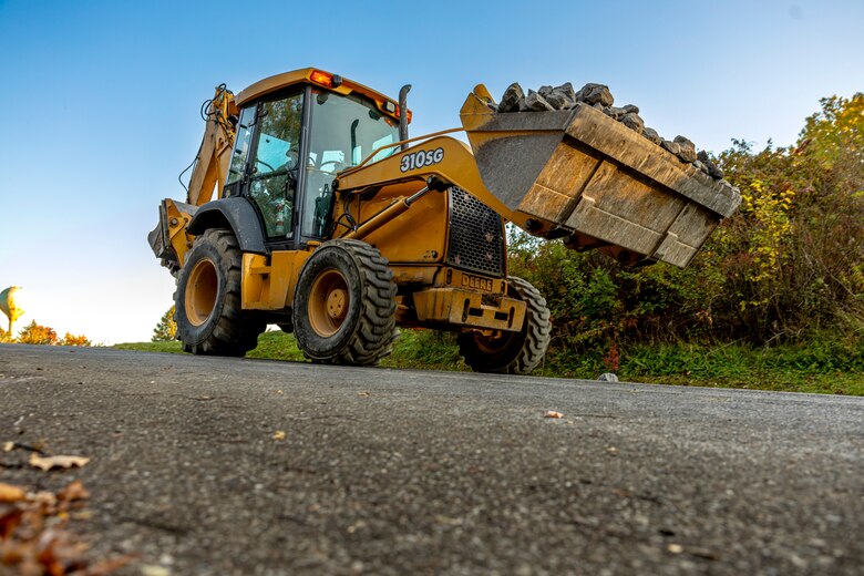 A maintenance mechanic with the U.S. Army Corps of Engineers Pittsburgh District completes a shoreline stabilization project work using a backhoe at Shenango River Lake.