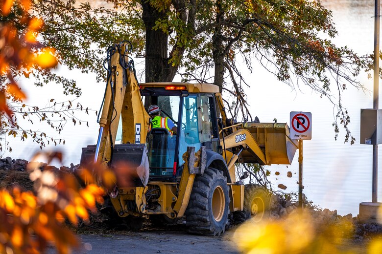 A maintenance mechanic with the U.S. Army Corps of Engineers Pittsburgh District completes a shoreline stabilization project work using a backhoe at Shenango River Lake.
