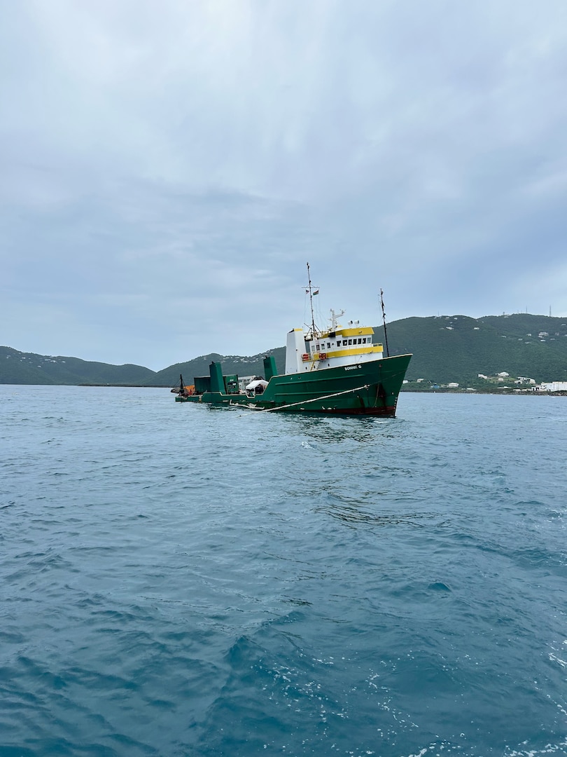 DonJon-SMIT, Inc. salvage crews and Playland Marine LLC pollution removal crews working during the refloat and towing of the cargo vessel Bonnie G to safe harbor at the Sandfill dock in St. Thomas, U.S. Virgin Islands, Oct. 30, 2023.  The Bonnie G Response Incident Command comprised of Coast Guard, federal and local agencies as well as the responsible party oversaw the operation. The Bonnie G cargo vessel ran aground half a mile south of the Cyril E. King airport in St. Thomas, Oct. 4, 2023.  (Bonnie G Response photo)