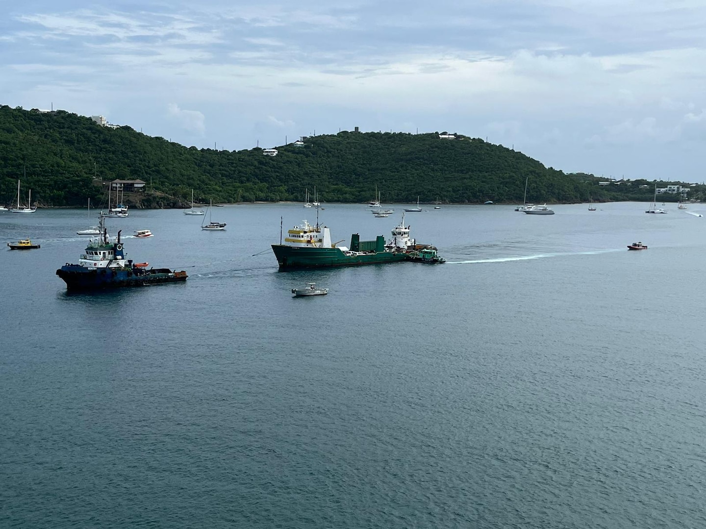 DonJon-SMIT, Inc. salvage crews and Playland Marine LLC pollution removal crews working during the refloat and towing of the cargo vessel Bonnie G to safe harbor at the Sandfill dock in St. Thomas, U.S. Virgin Islands, Oct. 30, 2023.  The Bonnie G Response Incident Command comprised of Coast Guard, federal and local agencies as well as the responsible party oversaw the operation. The Bonnie G cargo vessel ran aground half a mile south of the Cyril E. King airport in St. Thomas, Oct. 4, 2023.  (Bonnie G Response photo)