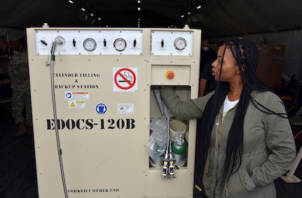 Dominique Druet, a logistics assistance representative, or LAR, with the Logistics Assistance Program under Army Medical Logistics Command, inspects a new Expeditionary Deployable Oxygen Concentration System, or EDOCS, during a recent training at Fort Detrick, Maryland. Members of the LAP, within AMLC’s Integrated Logistics Support Center, provide direct technical support and training to operational units in various Army field support brigades across the country. (C.J. Lovelace)