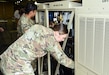 Soldiers with the 6th Medical Logistics Management Center inspect the new Expeditionary Deployable Oxygen Concentration System, or EDOCS, during a training event in late September at Fort Detrick, Maryland. (C.J. Lovelace)