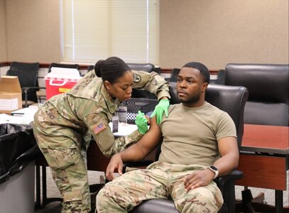 Leaders and Soldiers receive their influenza vaccination as the annual flu shot campaign kicks off, at the U.S. Army Aviation Center of Excellence headquarters at Fort Novosel, Ala., October 18, 2023. (U.S. Army photo by Kelly Morris)