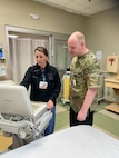 Heather Day-Lewis, an emergency department technician at Catholic Medical Center, and Master Sgt. John McDowell, an aerospace medicine technician with the 157th Medical Group, work a shift together Oct. 10, 2023 in the Emergency Department at CMC in Manchester, New Hampshire. McDowell was the first medic to pilot a new partnership between the New Hampshire Air National Guard and CMC that allows Airmen to hone their skills with patients in the hospital setting.