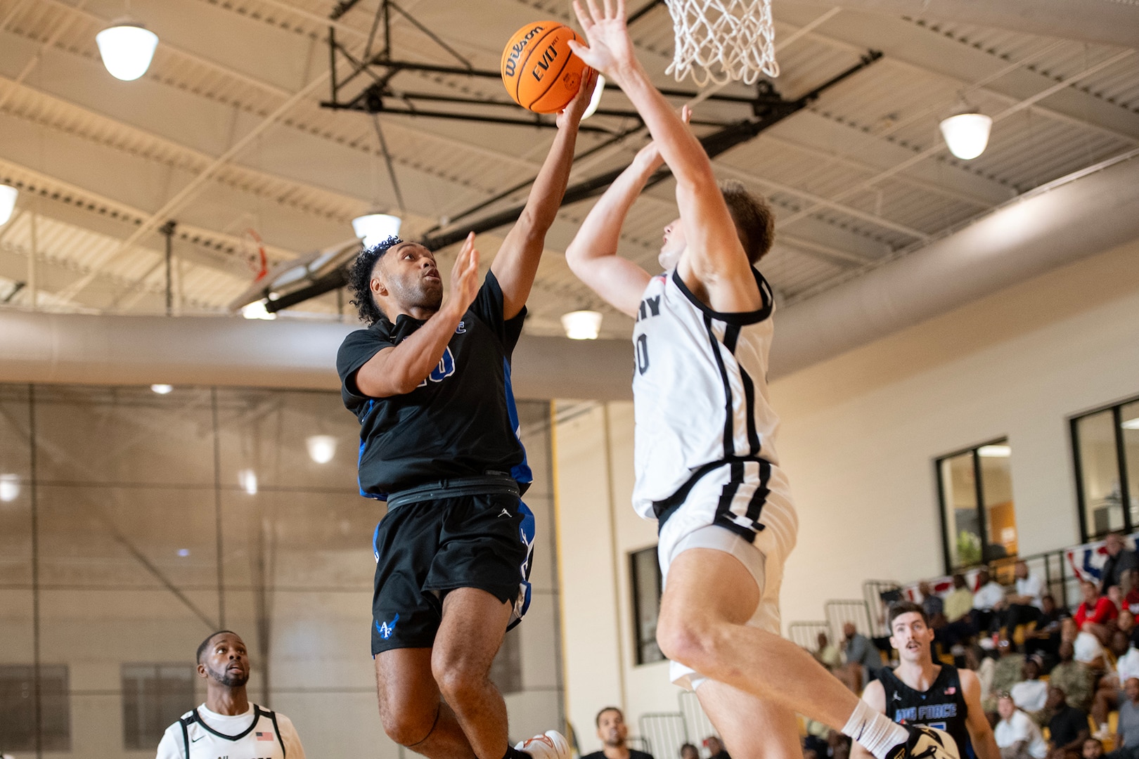 Air Force 2nd Lt. Anthony Welker puts in the final shot against Army during the opening game of the 2023 Armed Forces Men’s and Women’s Basketball Championships at Fort Moore, Ga. Oct. 30, 2023. Air Force won 61-56. (DoD photo by EJ Hersom)