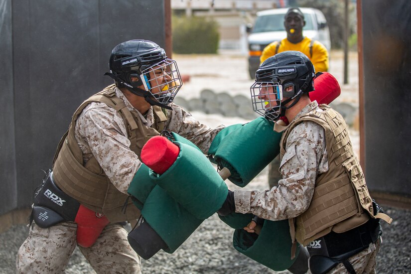 Marine Corps recruits compete with pugil sticks.
