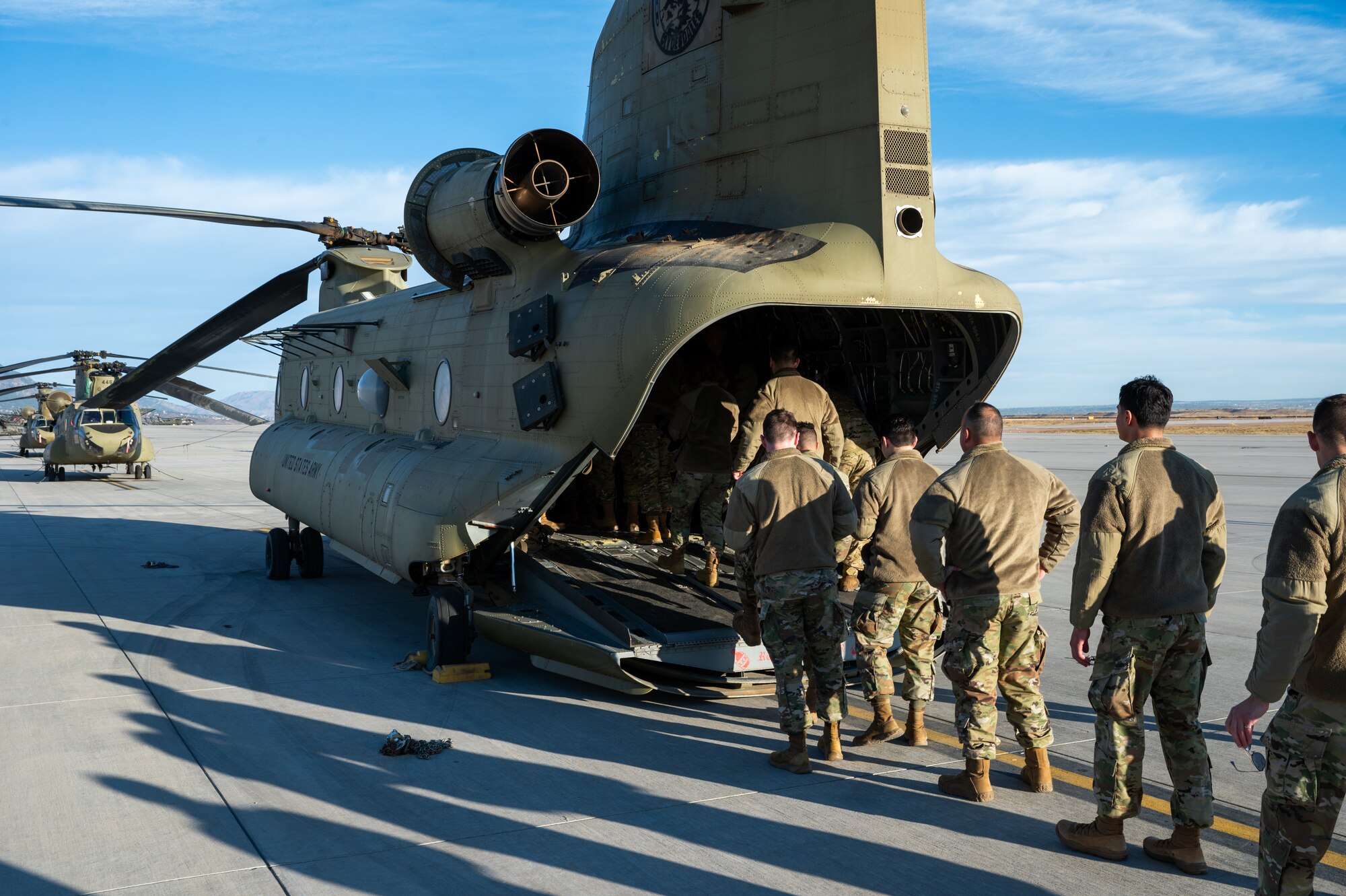 Guardians load onto a U.S. Army CH-47 Chinook for a partnership effort reenlistment flight.