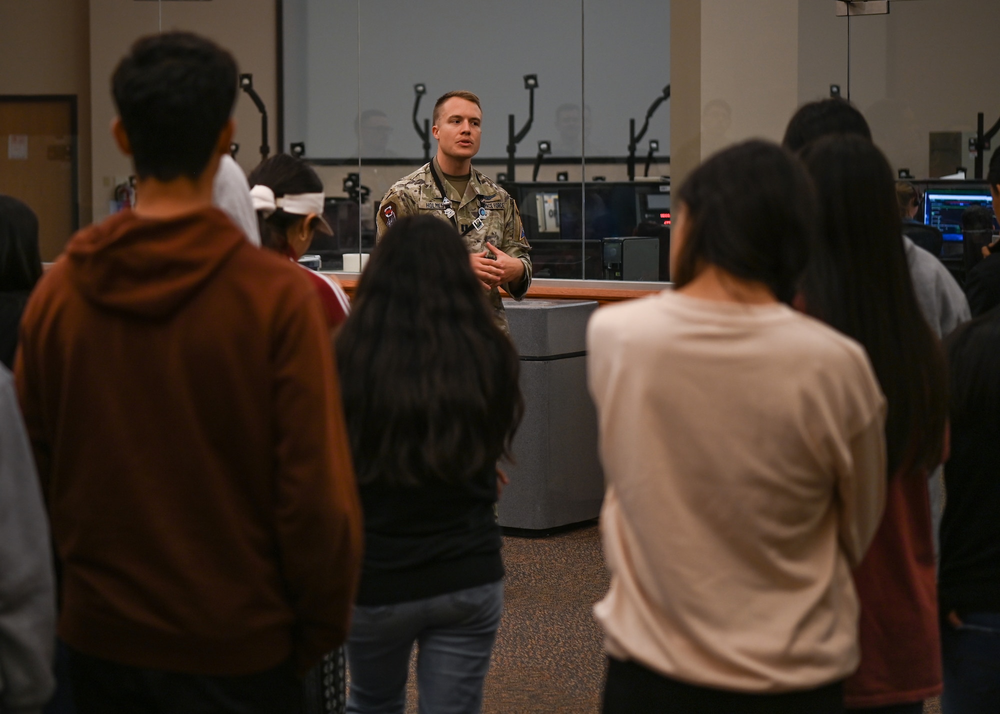 A military member explains what happens on launch day to eighth graders visiting Vandenberg Space Force Base.