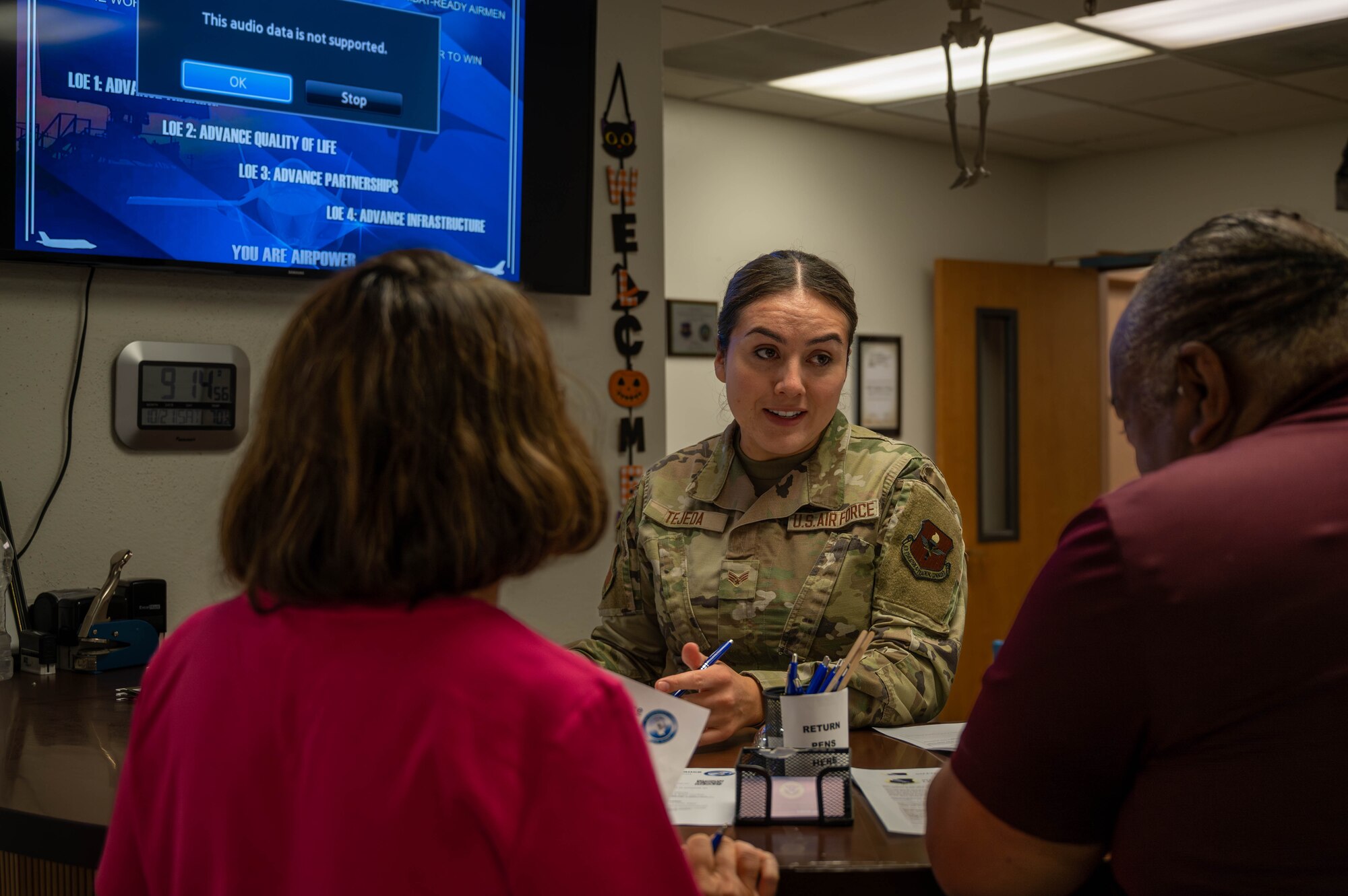 U.S. Air Force Senior Airman Cinthia Tejeda, 56th Fighter Judge Advocate paralegal, assists retirees at the Judge Advocate office during a retiree appreciation event October 21, 2023, at Luke Air Force Base, Arizona.