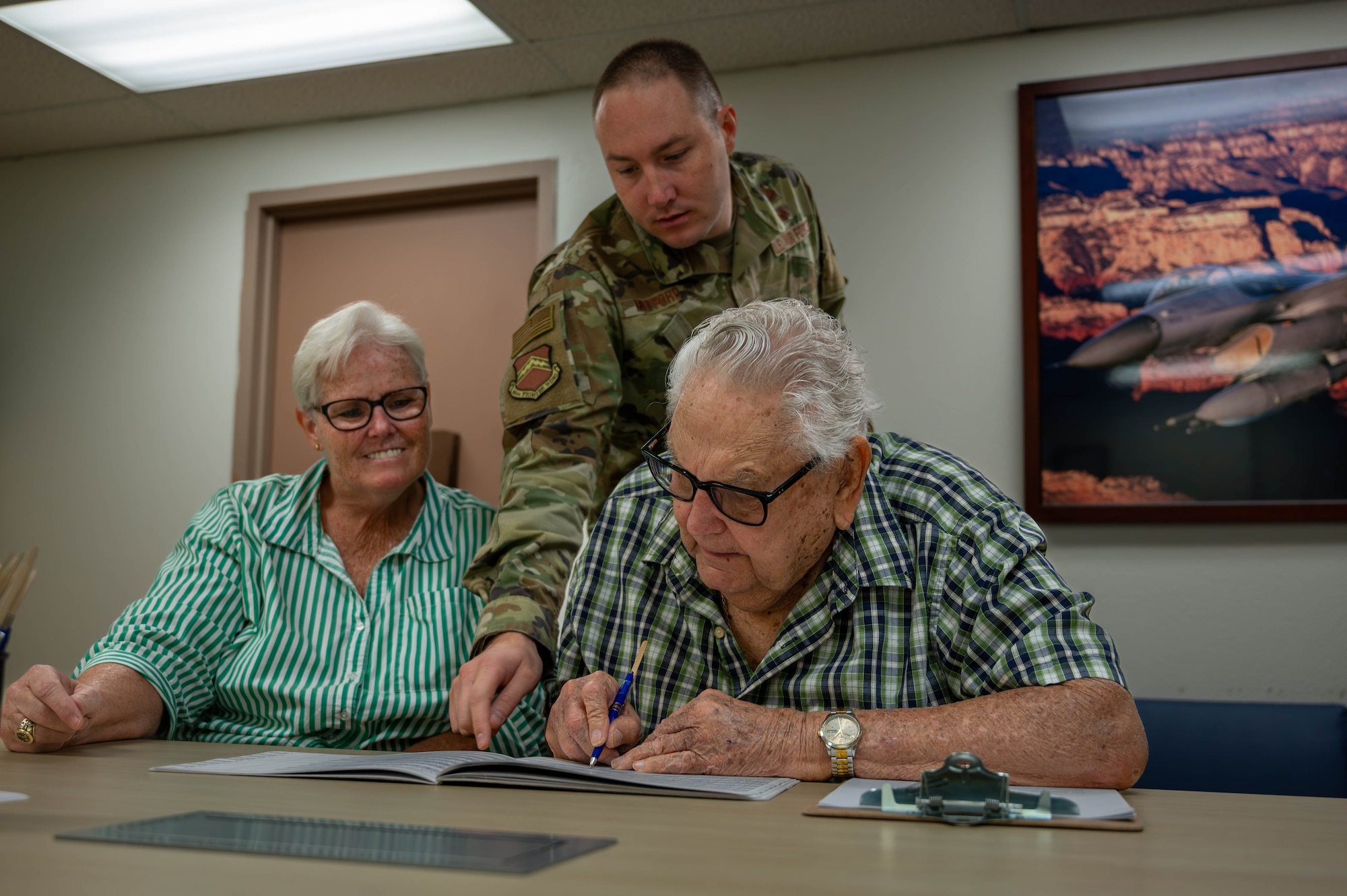 U.S. Air Force Master Sgt. Timothy Mefford, 56th Fighter Judge Advocate military justice noncommissioned officer in-charge, assists retirees at the Judge Advocate office during a retiree appreciation event October 21, 2023, at Luke Air Force Base, Arizona.