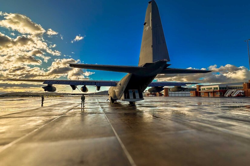 An aircraft sits on a tarmac.