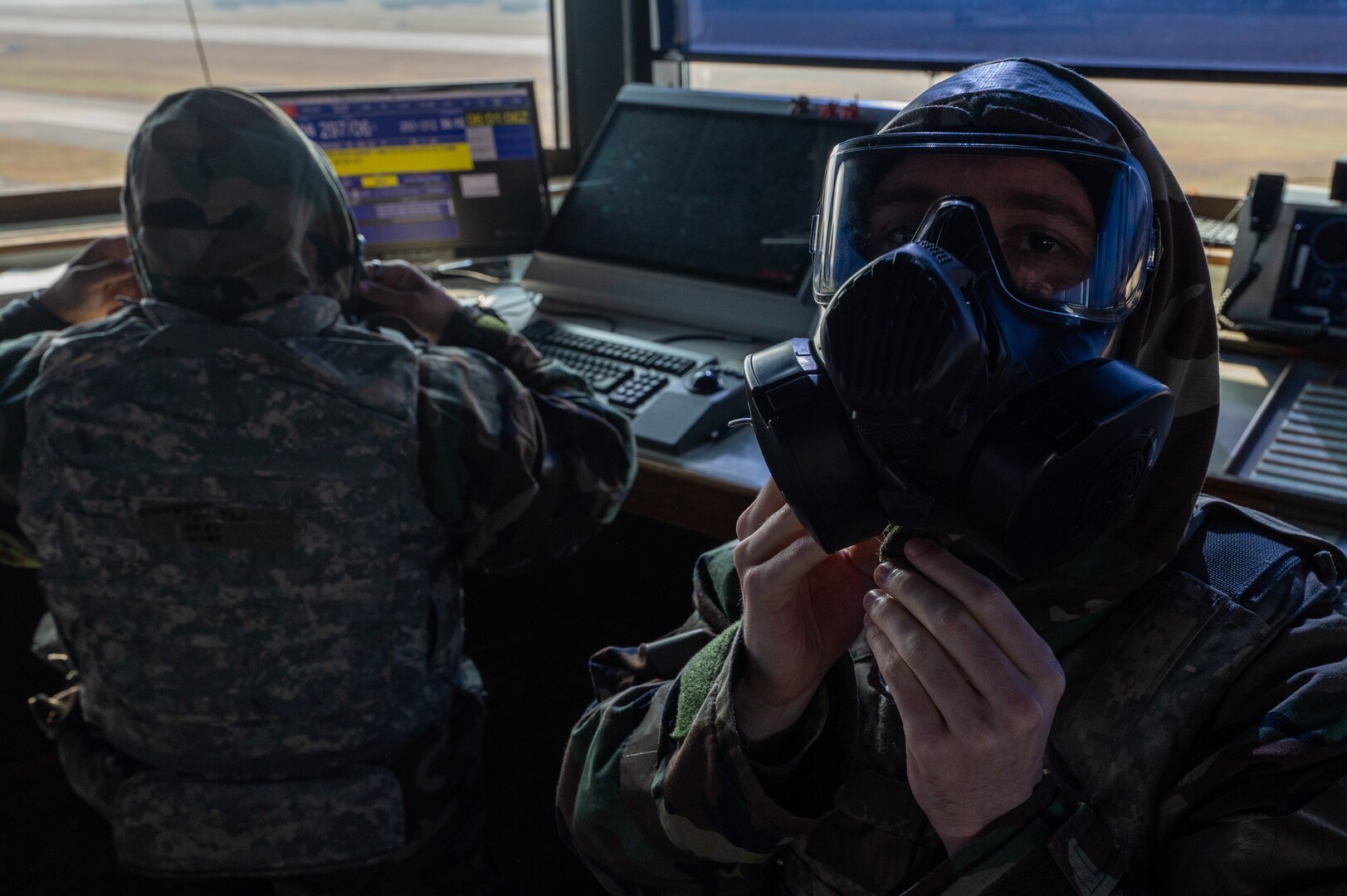 8th Operations Support Squadron air traffic control watch supervisors, don protective gear during Vigilant Defense 24 at Kunsan Air Base