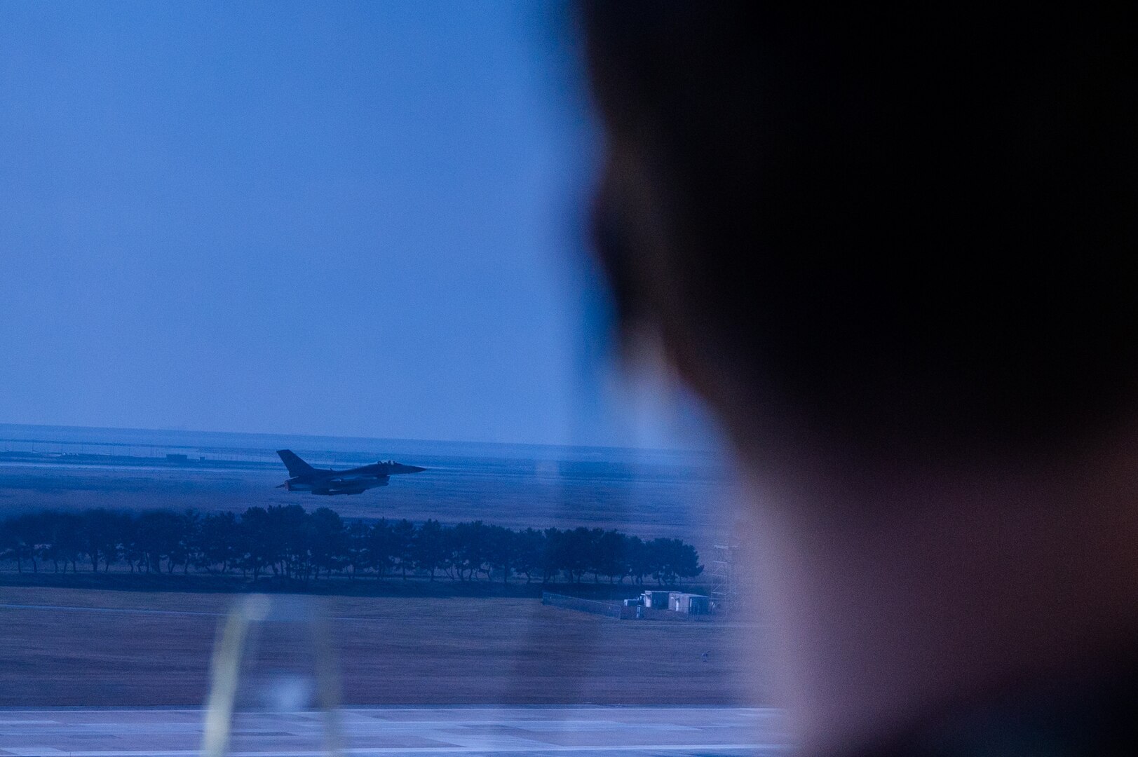 8th Operations Support Squadron air traffic control watch supervisor, observes the take-off of an F-16 Fighting Falcon during Vigilant Defense 24 at Kunsan Air Base