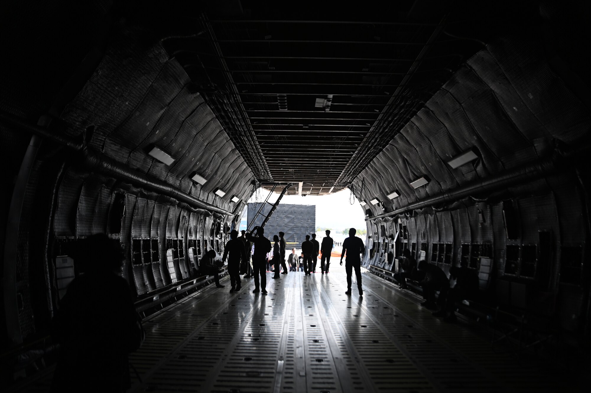 Visitors to the 2023 Seoul International Aerospace and Defense Exhibition walk through a U.S. Air Force C-5 Super Galaxy at Seoul Air Base, Republic of Korea, Oct. 18, 2023.