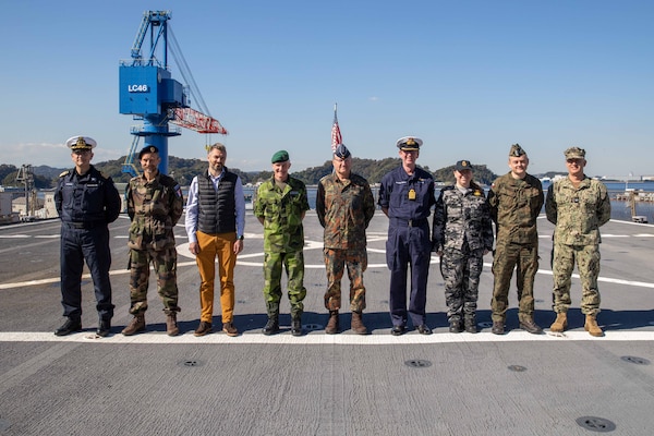 231028-N-WM182-1040 YOKOSUKA (October 26, 2023) Defense attaches from Finland, Italy, the United Kingdom, Germany, Poland, Sweden, Australia, Lithuania, and the U.S. assemble on the flight deck aboard the U.S. 7th Fleet flagship USS Blue Ridge (LCC-19). U.S. 7th Fleet is the U.S. Navy's largest forward-deployed numbered fleet, and routinely interacts and operates with allies and partners in preserving a free and open Indo-Pacific region. (U.S. Navy Photo by Mass Communication Specialist 2nd Class Caitlin Flynn)