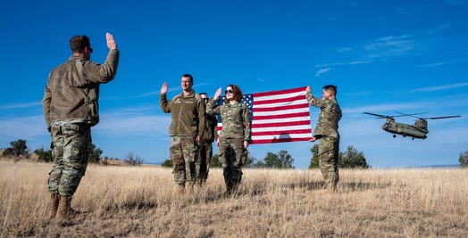  U.S. Guardians reenlist into the Space Force after a flight on a U.S. Army CH-47 Chinook