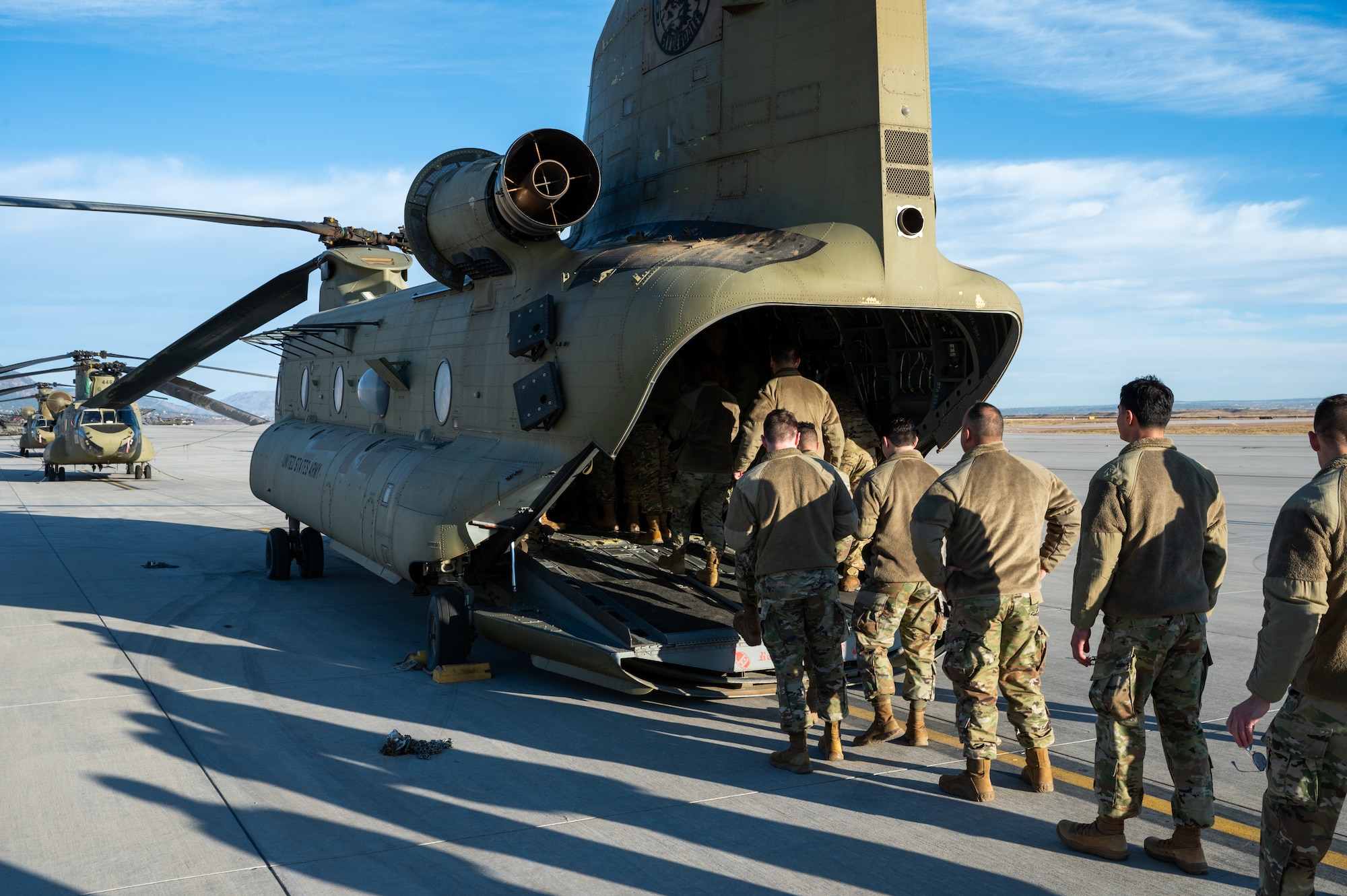 Guardians load onto a U.S. Army CH-47 Chinook for a partnership effort reenlistment flight.