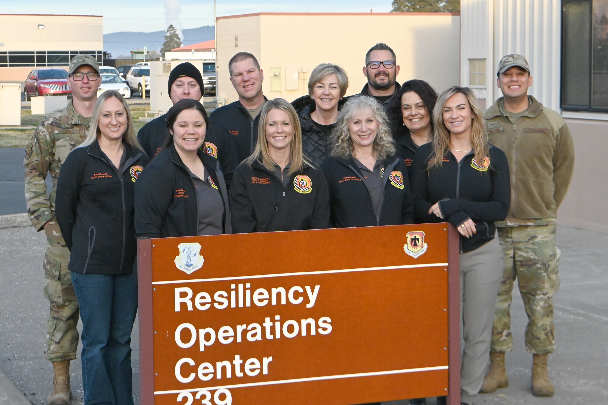 Resiliency Operations Center personnel pose in front of the ROC sign at Kinglsey Field in Klamath Falls, Oregon.