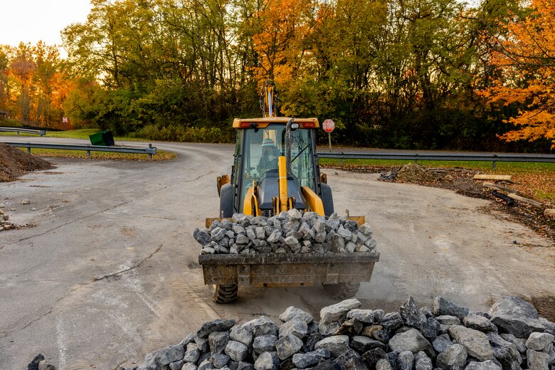 A maintenance mechanic with the U.S. Army Corps of Engineers Pittsburgh District completes a shoreline stabilization project work using a backhoe at Shenango River Lake.
