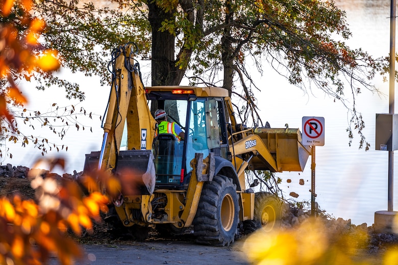 A maintenance mechanic with the U.S. Army Corps of Engineers Pittsburgh District completes a shoreline stabilization project work using a backhoe at Shenango River Lake.