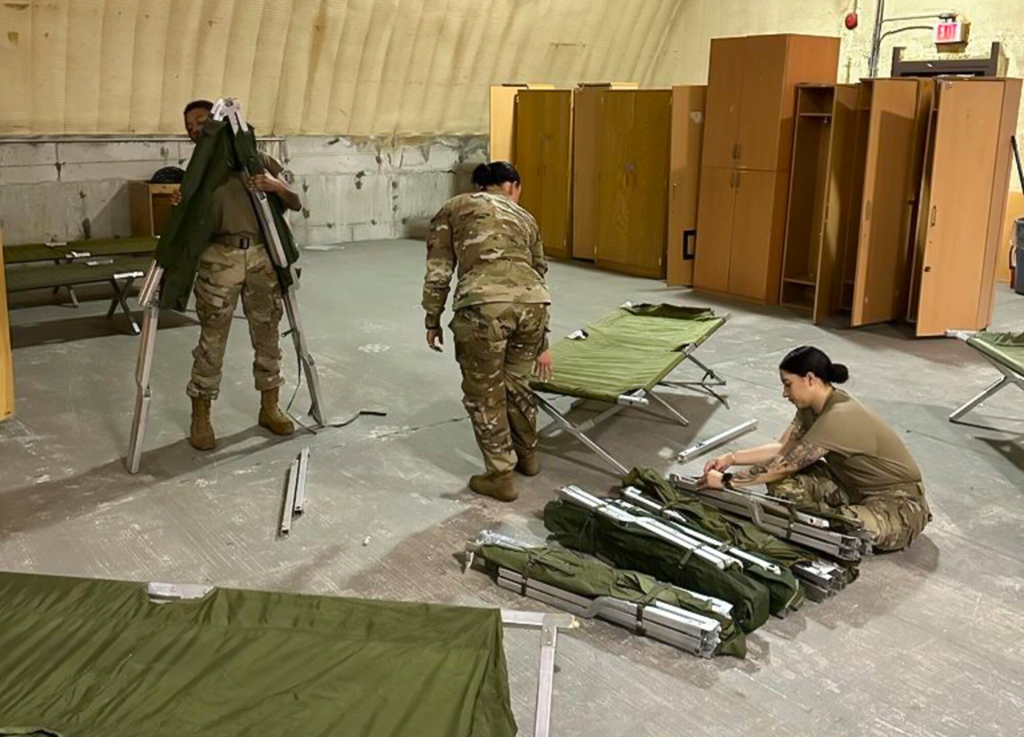 U.S. Air Force Airmen with the Base Operating Support-Integrator team, set up cots at Osan Air Base, Republic of Korea, on Aug. 1, 2023.