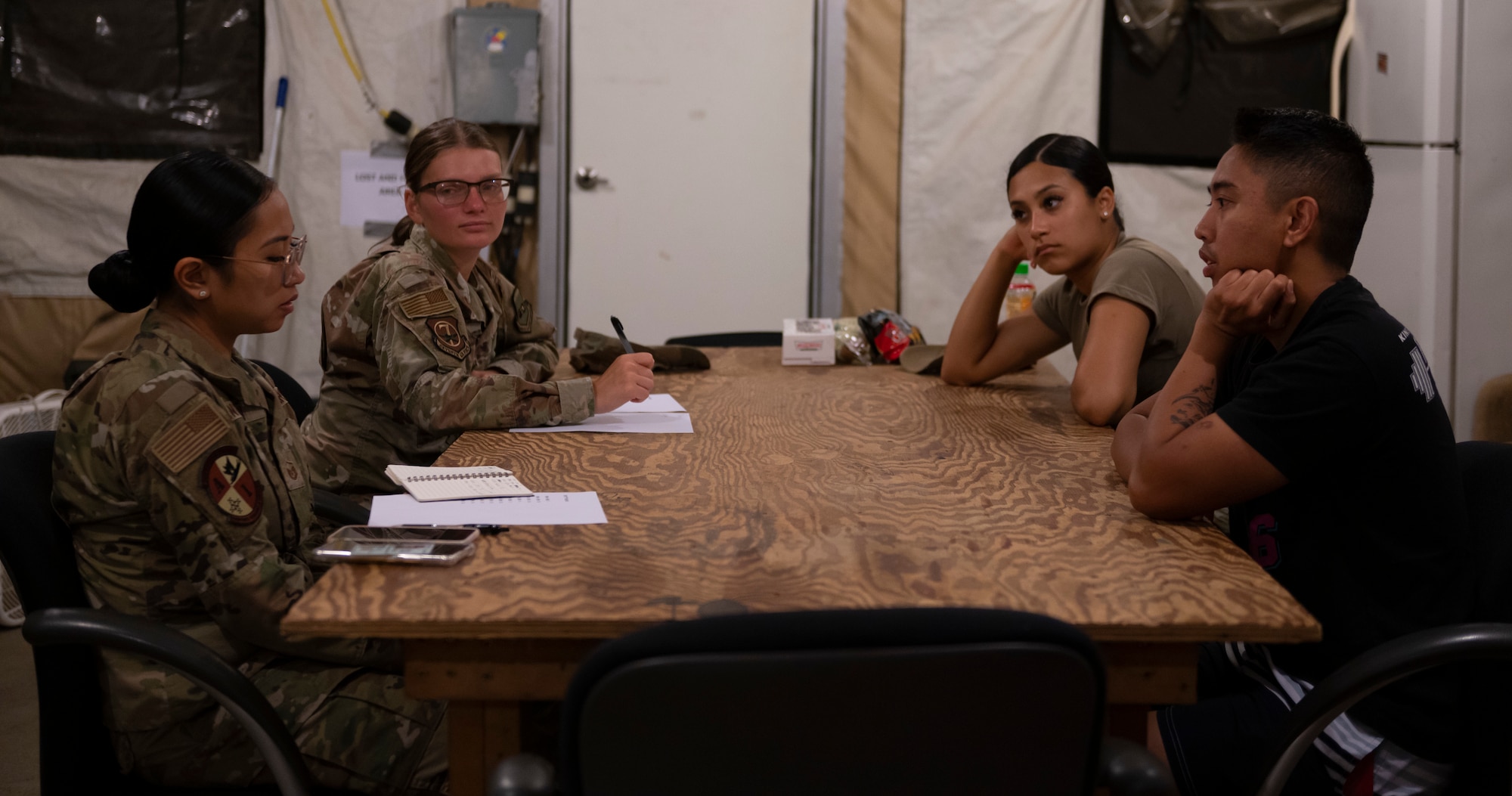 U.S. Air Force Airmen with the Base Operating Support-Integrator team, discuss ways to assist the Ulchi Freedom Shield 23 participants at Osan Air Base, Republic of Korea, on Aug. 24, 2023.