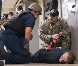 Sailors train on proper take down techniques aboard USS New York (LPD 21).