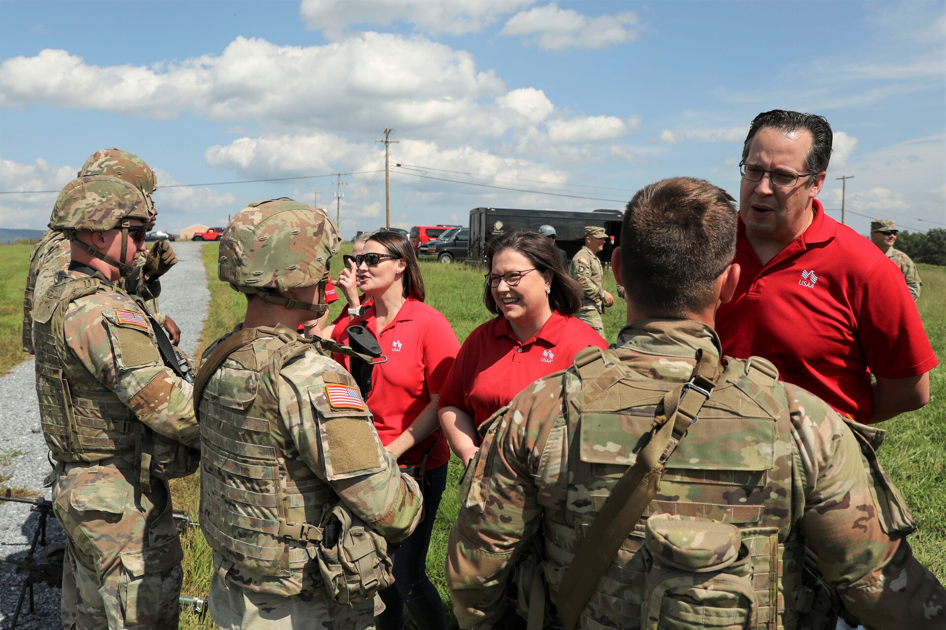 Twelve executives with USAA tour several facilities August 30 at Fort Indiantown Gap that showcase the capabilities and impact of the Pennsylvania National Guard. The two-day tour culminated with the executives coining members of the Pennsylvania National Guard’s Ambassador Demonstration Team after witnessing them perform an infantry maneuver. (U.S. Army National Guard photo by Sgt. 1st Class Zane Craig)
