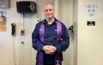 Auxiliary Chaplain Support chaplain Rev. Benjamin Shambaugh readies for a Sunday service for cutter personnel returning from an Operation Valiant Shield assignment. (U.S. Coast Guard Auxiliary photo, courtesy of Rev. Benjamin Shambaugh)