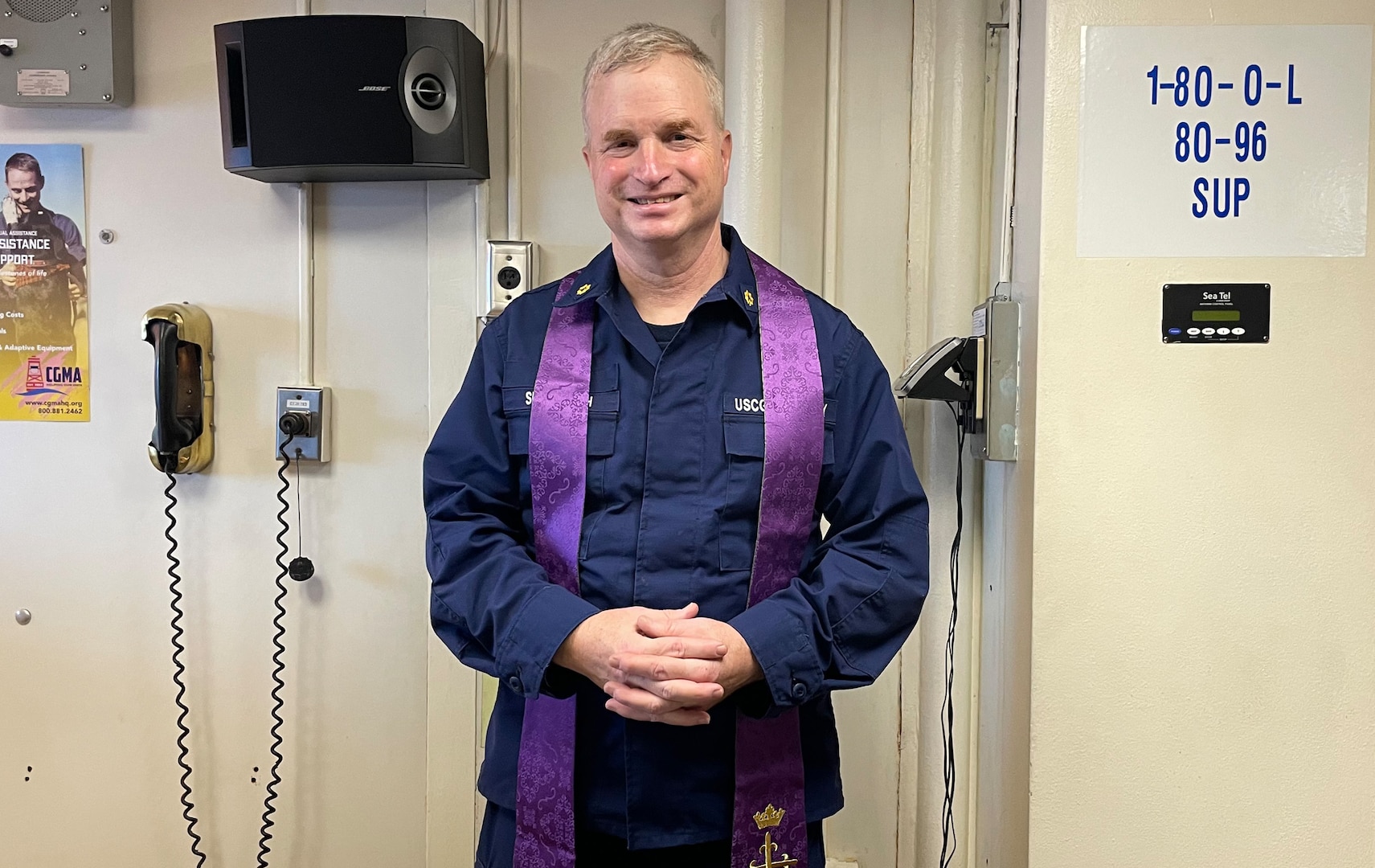 Auxiliary Chaplain Support chaplain Rev. Benjamin Shambaugh readies for a Sunday service for cutter personnel returning from an Operation Valiant Shield assignment. (U.S. Coast Guard Auxiliary photo, courtesy of Rev. Benjamin Shambaugh)