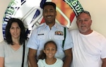 Petty Officer 1st Class Benjamin Davis, center, with daughter Emma and his parents at Training Center Petaluma, Calif., in 2022.