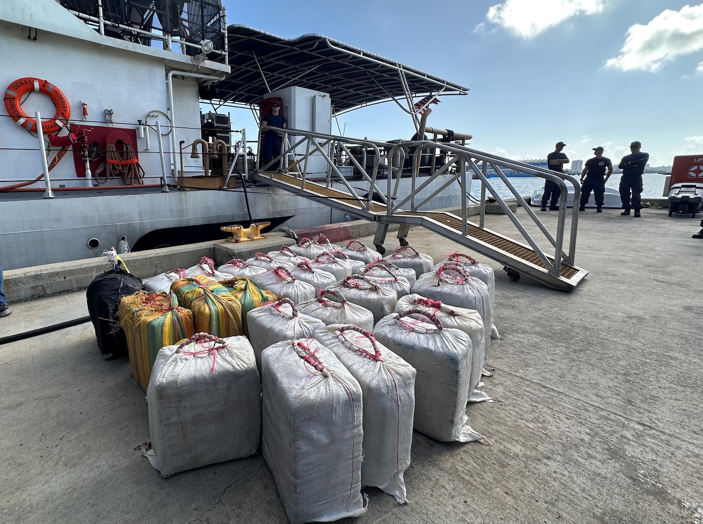 Coast Guard Cutter Donald Horsley crew members offload and transfer $19 million in seized cocaine to federal law enforcement agents in San Juan, Puerto Rico, Aug. 31, 2023.  The seizure resulted from the interdiction of a go-fast vessel in Caribbean Sea waters southeast of Yabocoa, Puerto Rico Aug. 26, 2023.  Three smugglers apprehended in this are facing federal prosecution in Puerto Rico. (U.S. Coast Guard photo by Ricardo Castrodad)