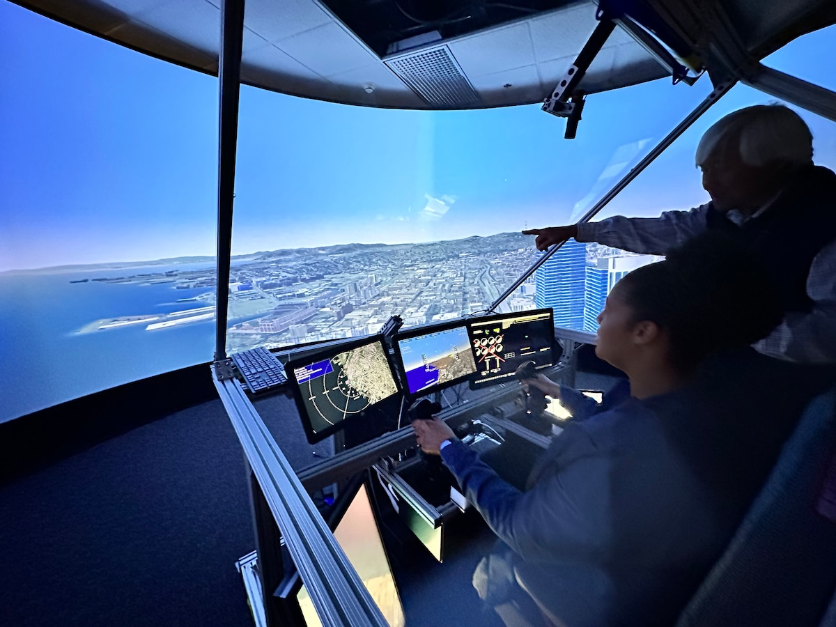 AFWERX Prime employees fly a simulator during a tour of the NASA Ames Research Center in Mountain View, California, May 2, 2023. During the visits, the Prime team received an in-depth tour of the resources and areas of expertise available at each of the research centers (Contributed photo)
