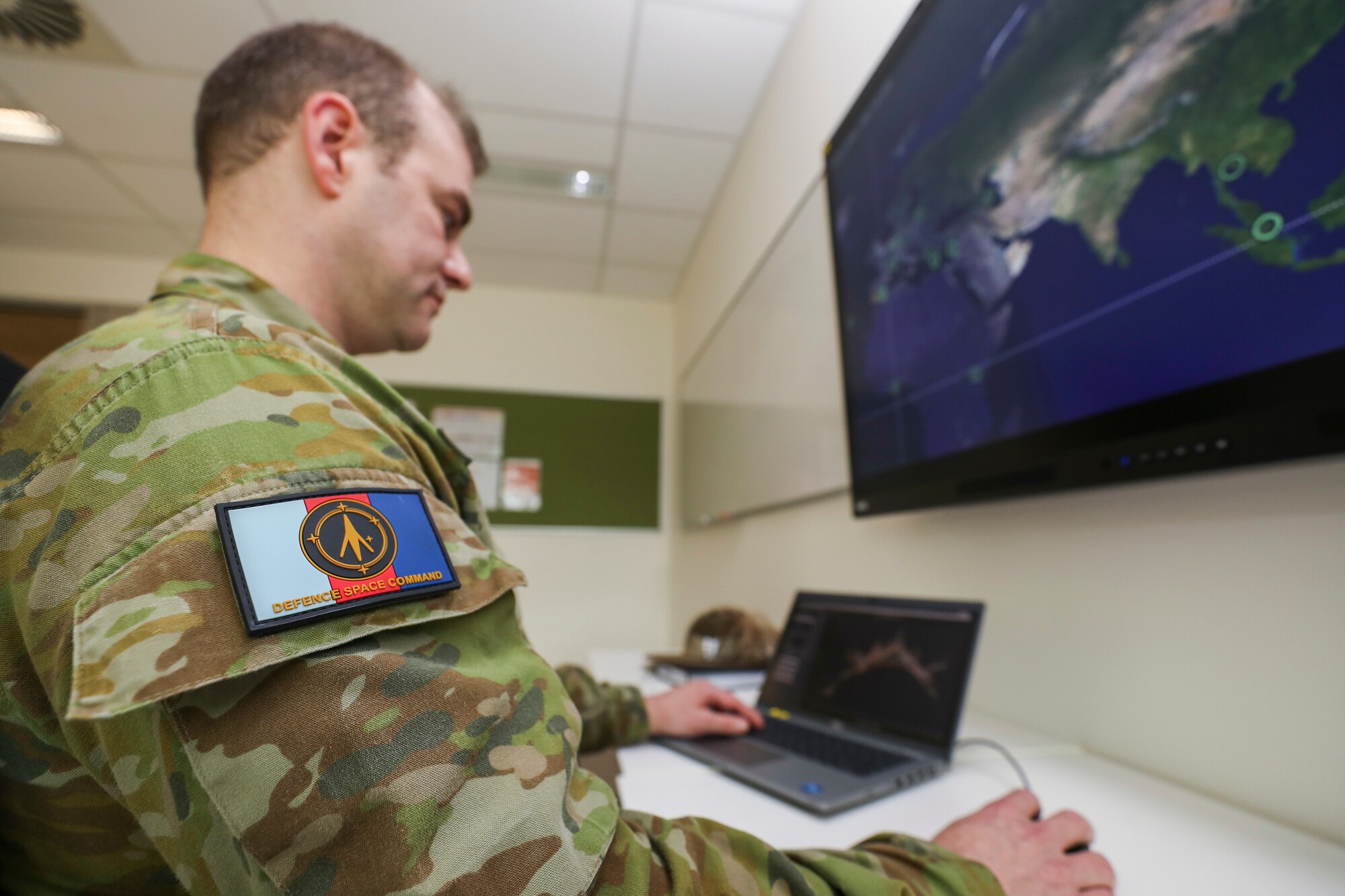 man looking at computer screen