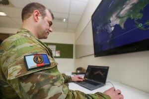 man looking at computer screen