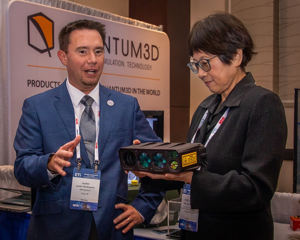 WASHINGTON (August 29, 2023) - Defense Undersecretary for Research and Engineering Heidi Shyu, speaks with Justin McRoberts, Department of Defense Manufacturing Science and Technology Program program manager, about the MSTP Precision Optical Wind Sensor project at the Emerging Technologies for Defense Conference and Exhibition, August 29, 2023.