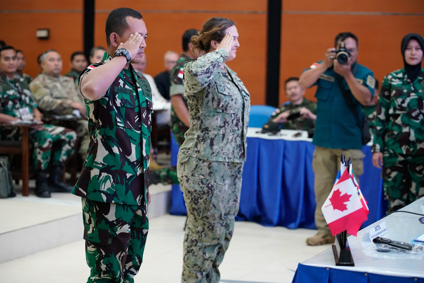 Maj. Aris, Tentara Nasional Indonesia (TNI) and Lt. Abbey Taylor, U.S. Navy, HSC-3, offer the first salute during the opening ceremony of the staff exercise portion of Super Garuda Shield 2023 (SGS23) August 31, 2023, Surabaya Indonesia. #SuperGarudaShield 2023 is an annual exercise that has significantly grown in scope and size since 2009. #SGS2023 is the second consecutive time this exercise has grown into a combined and #joint event, highlighting the 6 participating and 12 observing nations’ commitment to #partnership and a #freeandopenindopacific. (US Air National Guard Photo by Air Force Master Sgt. Andrew Lee Jackson)