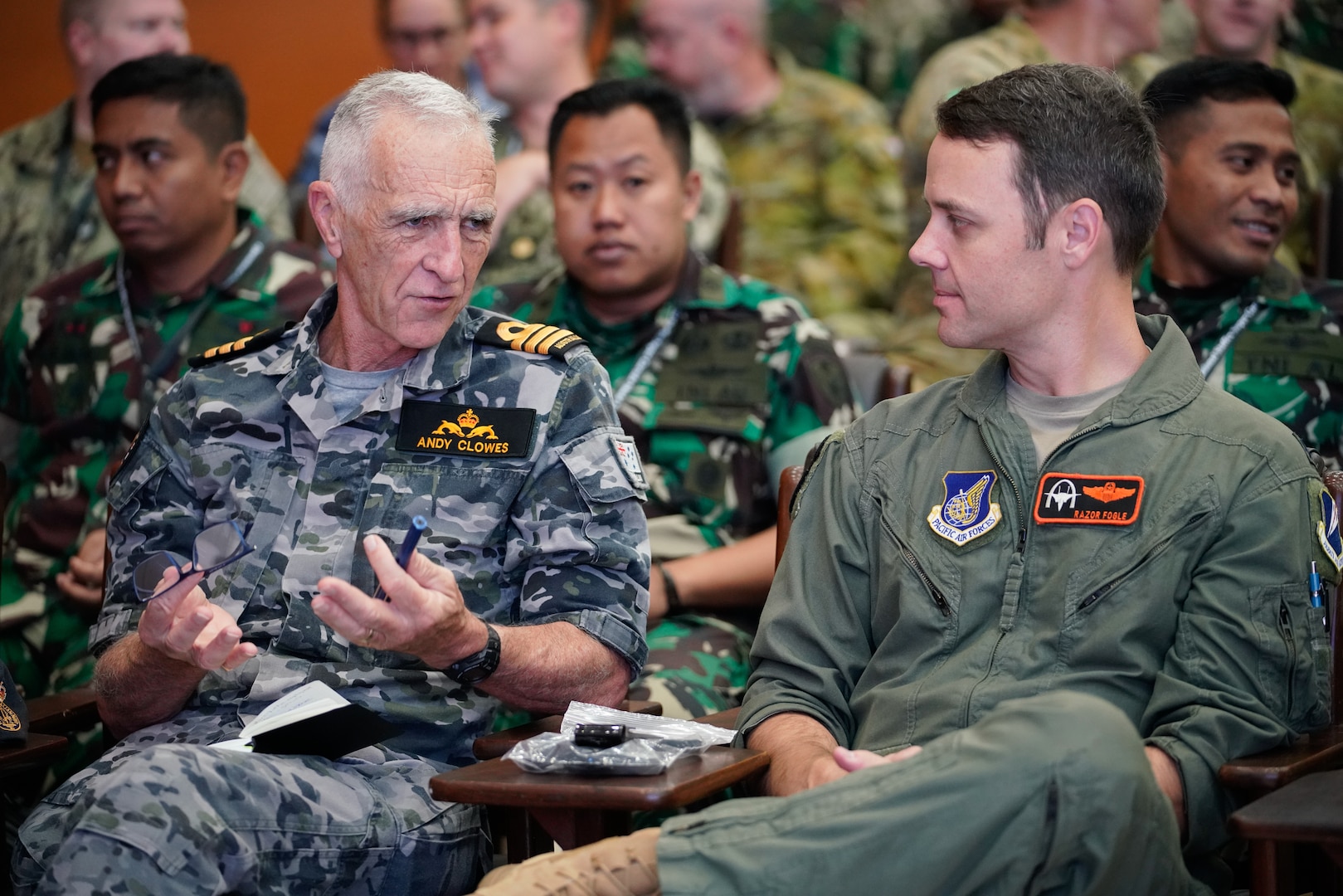 Capt. John Rauch, U.S. Marines, and Maj. Kriyanto, Tentara Nasional Indonesia (TNI) discuss what they expect from the staff exercise portion of Super Garuda Shield 2023 (SGS23) August 31, 2023, Surabaya Indonesia. #SuperGarudaShield 2023 is an annual exercise that has significantly grown in scope and size since 2009. #SGS2023 is the second consecutive time this exercise has grown into a combined and #joint event, highlighting the 6 participating and 12 observing nations’ commitment to #partnership and a #freeandopenindopacific. (US Air National Guard Photo by Air Force Master Sgt. Andrew Lee Jackson)